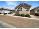 Single-story home with a brick driveway, tile roof, and desert landscaping at 4171 E Ronald St, Gilbert, AZ 85295