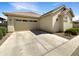 Single-story home with a two car garage and neutral colored exterior at 4171 E Ronald St, Gilbert, AZ 85295