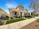 Beautiful home with stone accents, manicured landscaping, and a welcoming entrance at 4171 E Ronald St, Gilbert, AZ 85295
