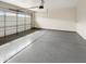 Clean, empty garage with epoxy flooring and garage door opener at 4171 E Ronald St, Gilbert, AZ 85295