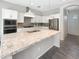 Bright kitchen featuring a granite island, stainless appliances, and white cabinetry at 4171 E Ronald St, Gilbert, AZ 85295