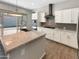 Modern kitchen featuring granite countertops, stainless appliances, and large sliding glass doors at 4171 E Ronald St, Gilbert, AZ 85295