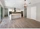 Open concept kitchen featuring an island, stainless steel appliances, and tile flooring at 4171 E Ronald St, Gilbert, AZ 85295