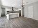 Bright kitchen with an island, modern appliances, and stylish pendant lighting at 4171 E Ronald St, Gilbert, AZ 85295