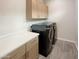 Well-equipped laundry room with modern washer, dryer, and counterspace at 4171 E Ronald St, Gilbert, AZ 85295
