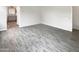 Open-concept living room with durable tile flooring leading to ensuite at 4171 E Ronald St, Gilbert, AZ 85295