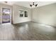 Sunlit living room with tile floors, neutral walls, and views of the front yard at 4171 E Ronald St, Gilbert, AZ 85295