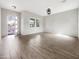 Spacious living room with wood-look tile flooring, ample natural light, and neutral color palette at 4171 E Ronald St, Gilbert, AZ 85295