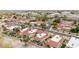 An aerial view of homes with red tiled roofs in a well-maintained neighborhood with desert landscaping at 4436 E Shomi St, Phoenix, AZ 85044