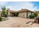 Charming backyard patio with brick pavers, outdoor seating, and desert landscaping offering a private retreat at 4436 E Shomi St, Phoenix, AZ 85044