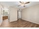 Bedroom features hardwood floors and an ensuite bath at 4436 E Shomi St, Phoenix, AZ 85044