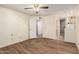 View of a cozy bedroom featuring wood flooring and open entryways at 4436 E Shomi St, Phoenix, AZ 85044