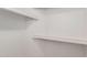 Image shows a walk-in closet with clean, white walls and built-in shelving for ample storage at 4436 E Shomi St, Phoenix, AZ 85044