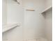 A walk-in closet with organized storage and a minimalist design at 4436 E Shomi St, Phoenix, AZ 85044
