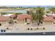 View of a single-story home with a red tile roof, desert landscaping, and a two-car garage at 4436 E Shomi St, Phoenix, AZ 85044