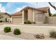 Charming single-story house with red tile roof, garage and low-maintenance landscaping at 4436 E Shomi St, Phoenix, AZ 85044
