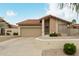 Charming single-story home with tile roof, desert landscaping, and a two-car garage at 4436 E Shomi St, Phoenix, AZ 85044
