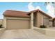 Inviting single-story home featuring a clay tile roof and attached two car garage at 4436 E Shomi St, Phoenix, AZ 85044