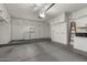 Spacious garage with built in cabinets, washer and dryer, and work area at 4436 E Shomi St, Phoenix, AZ 85044