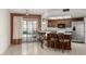 Eat-in kitchen offers stainless steel appliances, counter seating, and backyard access at 4436 E Shomi St, Phoenix, AZ 85044