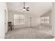 Bright and open living area featuring vaulted ceilings and neutral carpet at 4436 E Shomi St, Phoenix, AZ 85044
