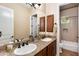 Well-lit bathroom with double sinks, granite countertops, and a shower/tub combination at 5414 E Palo Brea Ln, Cave Creek, AZ 85331