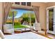 Bedroom view featuring two chairs and view to the backyard which features a pool at 5414 E Palo Brea Ln, Cave Creek, AZ 85331