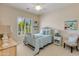 Charming bedroom with white iron bed frame, soft blue bedding, and natural light from window at 5414 E Palo Brea Ln, Cave Creek, AZ 85331