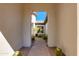 Pathway through a decorative arched entry, leading to the front door at 5414 E Palo Brea Ln, Cave Creek, AZ 85331