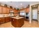 Gourmet kitchen with stainless steel appliances, custom cabinets, and an island at 5414 E Palo Brea Ln, Cave Creek, AZ 85331