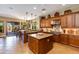 Gourmet kitchen with stainless steel appliances, custom cabinets, and an island at 5414 E Palo Brea Ln, Cave Creek, AZ 85331