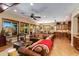 Spacious living room boasts wood beams, windows and hardwood floors at 5414 E Palo Brea Ln, Cave Creek, AZ 85331