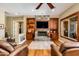 Inviting living room features a stone fireplace and built-in cabinets at 5414 E Palo Brea Ln, Cave Creek, AZ 85331