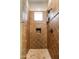 Tiled stand up shower with a rainfall shower head and decorative tiling at 5414 E Palo Brea Ln, Cave Creek, AZ 85331