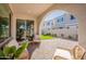 Inviting outdoor patio with comfortable seating, offering a relaxing view of the landscaped backyard at 560 W Copper Way, Chandler, AZ 85225