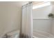Clean bathroom featuring a tub/shower combo with curtain at 560 W Copper Way, Chandler, AZ 85225