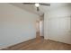 Neutral bedroom featuring wood floors and closet with sliding doors at 560 W Copper Way, Chandler, AZ 85225