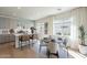 Bright dining area featuring a round table, four chairs, and large windows for abundant natural light at 560 W Copper Way, Chandler, AZ 85225
