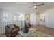 Bright living room featuring neutral décor, comfortable seating, a table and window providing natural light at 560 W Copper Way, Chandler, AZ 85225