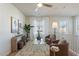 Bright living room with neutral decor, seating, table, and a window provides natural light in the house at 560 W Copper Way, Chandler, AZ 85225