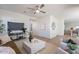 Open-concept living room with hardwood floors, contemporary decor, and a view into the kitchen at 560 W Copper Way, Chandler, AZ 85225
