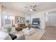 Bright living room with modern furnishings, a large window, and an open layout that connects to other living spaces at 560 W Copper Way, Chandler, AZ 85225