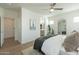 Bright primary bedroom with a neutral palette, ensuite bathroom, and a window providing plenty of natural light at 560 W Copper Way, Chandler, AZ 85225