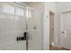 Modern shower with white subway tile, frameless glass door, a built-in seat, and a window at 560 W Copper Way, Chandler, AZ 85225