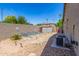 Functional backyard featuring a decorative rock landscape, convenient storage shed, and easy access to the home's exterior at 579 E Mary Ct, Gilbert, AZ 85295