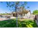 Charming backyard featuring a pool, patio area with outdoor seating, and lush green lawn at 579 E Mary Ct, Gilbert, AZ 85295