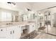 Bright bathroom with dual sinks, large mirrors, and a bathtub, creating a spa-like experience at 579 E Mary Ct, Gilbert, AZ 85295