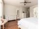 Spacious bedroom featuring hardwood floors, ceiling fan, and bright natural light at 579 E Mary Ct, Gilbert, AZ 85295