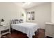 Cozy bedroom with natural light, closet, and wooden floors, creating a serene retreat at 579 E Mary Ct, Gilbert, AZ 85295