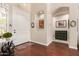 Elegant entryway with hardwood floors, white door, decorative niches, and a charming antique table at 579 E Mary Ct, Gilbert, AZ 85295